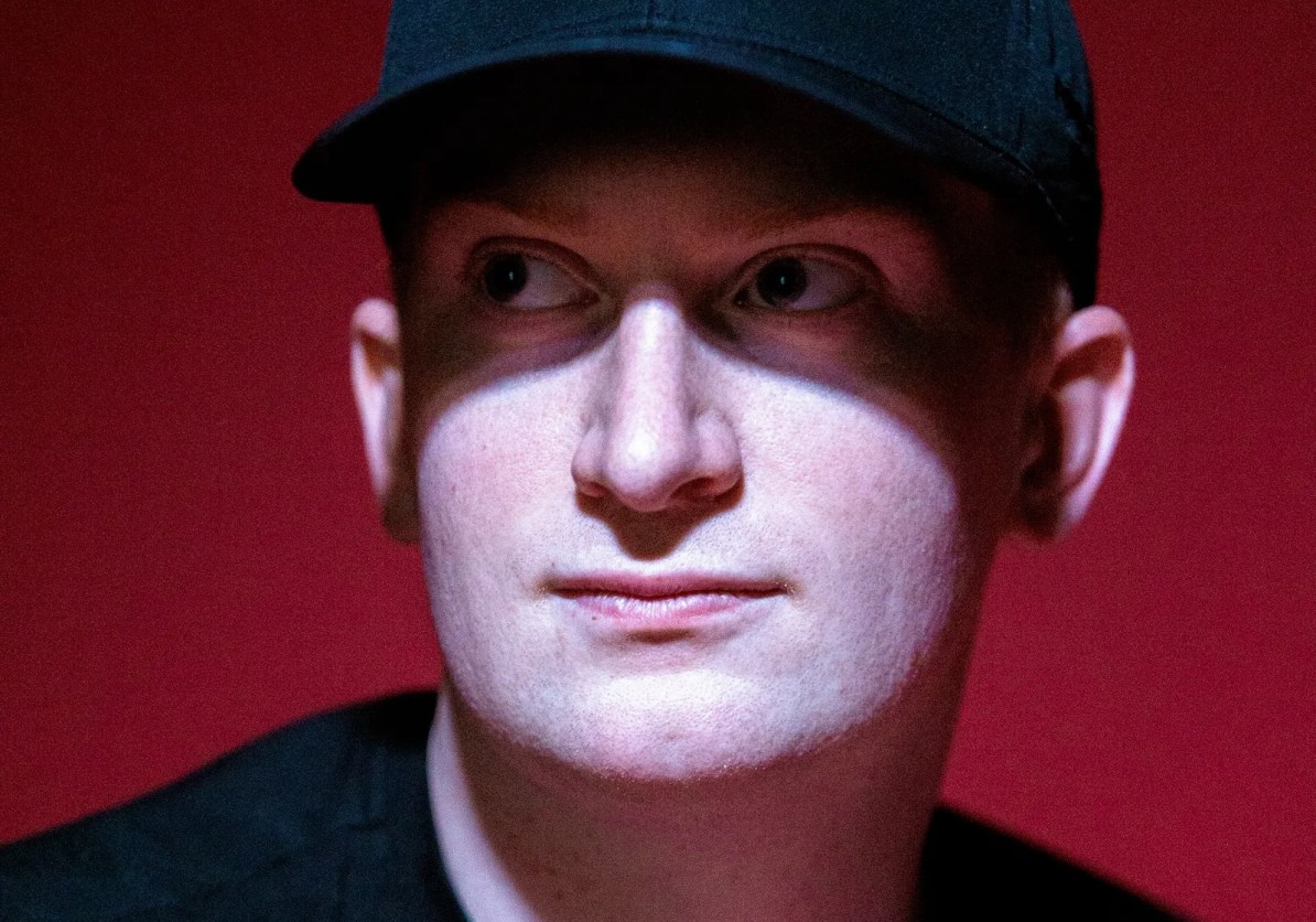 Simon Wijckmans, the CEO of web security company C.Side, wears a black baseball cap in a shadow profile photograph by Darrell Jackson